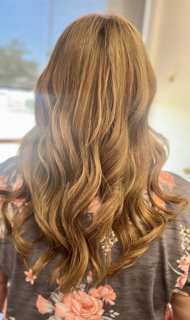 After — full, flowing wavy blonde hair