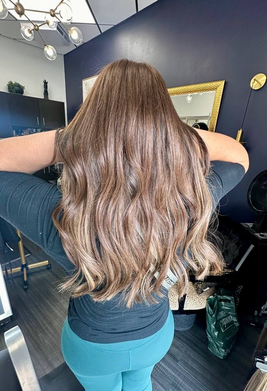 After — full, long wavy brunette hair